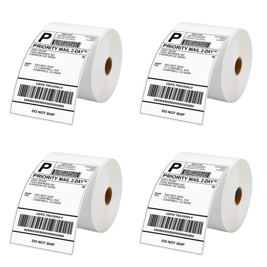 Four rolls of white direct thermal waybill labels with printed barcodes and 'PRIORITY MAIL' text, indicating they are used for shipping and logistics.